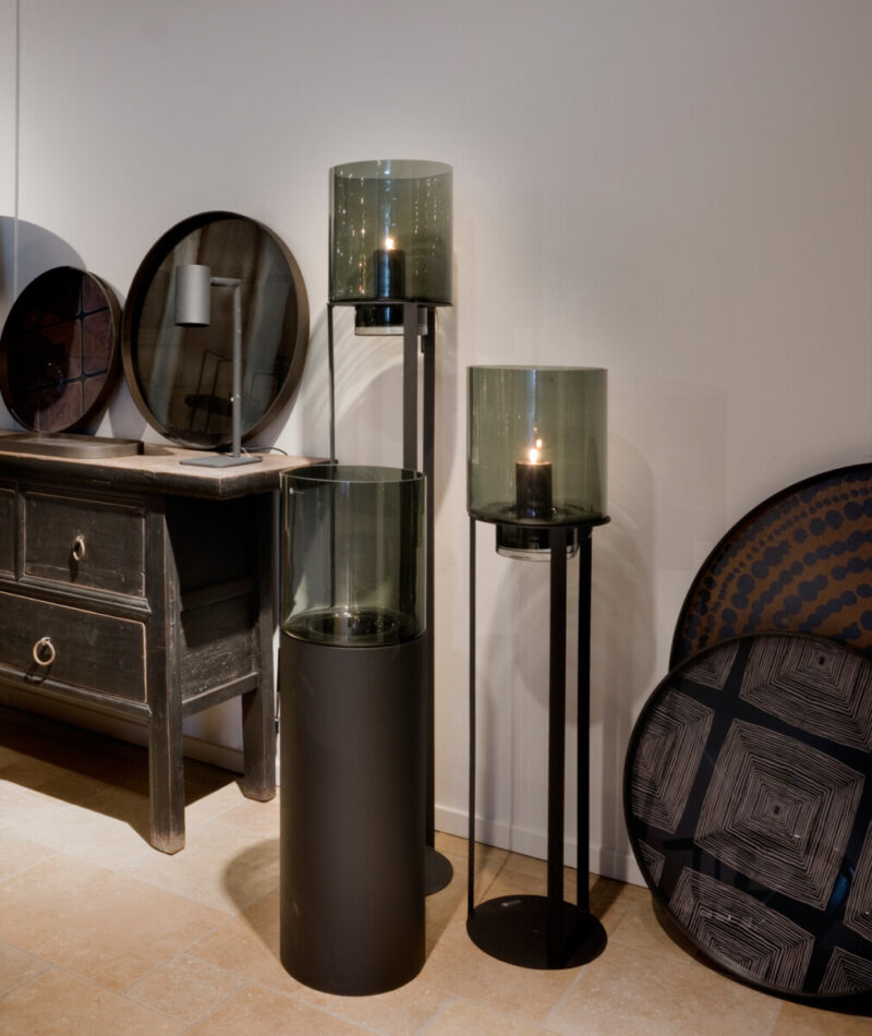 Three glass lanterns with candles