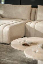 Modern sofa with side tables.