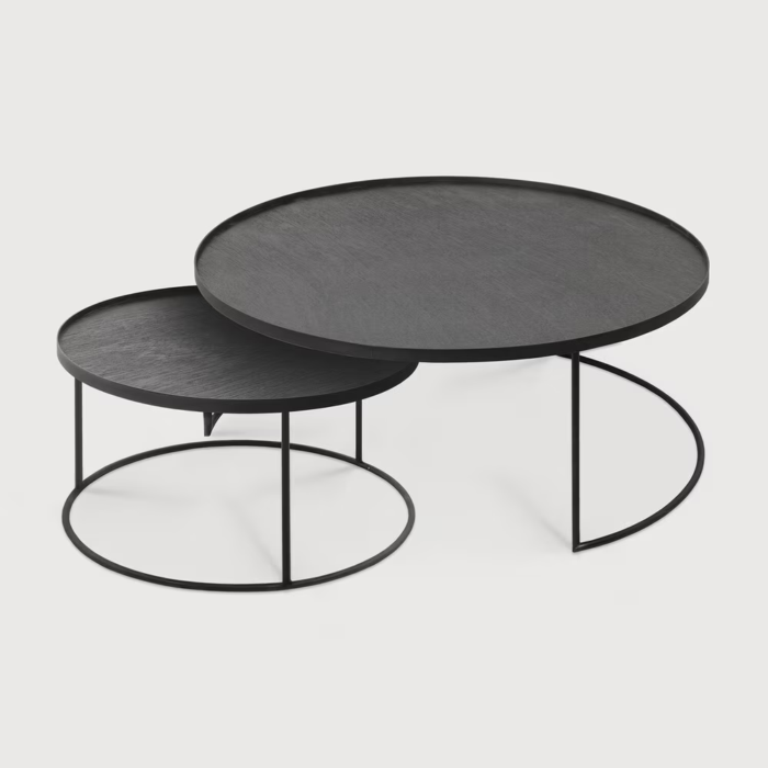 Two round black coffee tables.