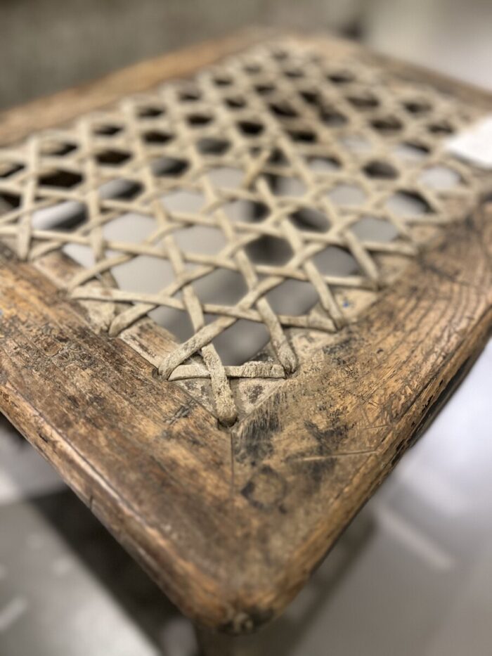 Wooden table with braided edges