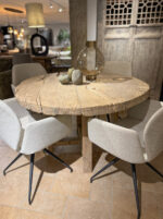 Wooden table with modern chairs
