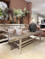 Wooden table with decorative vases