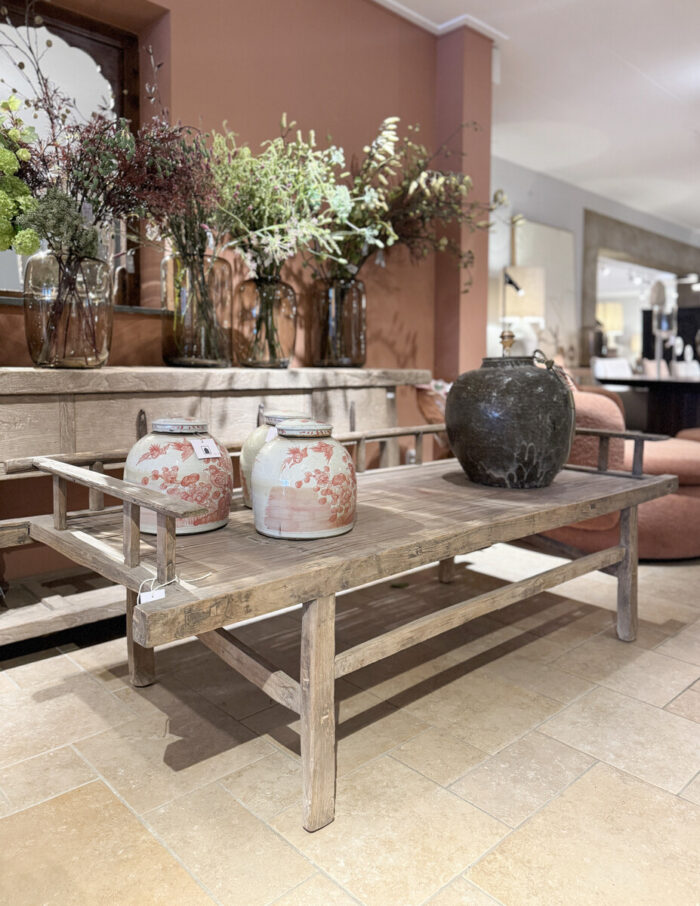 Wooden table with decorative vases