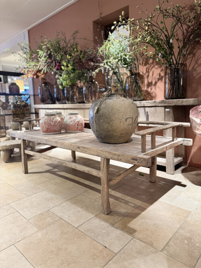 Wooden table with decorative vases