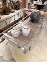 Three pots on a wooden table