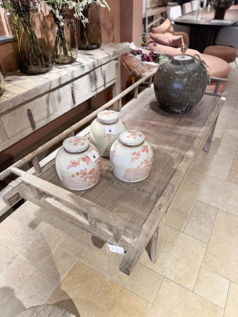 Three pots on a wooden table