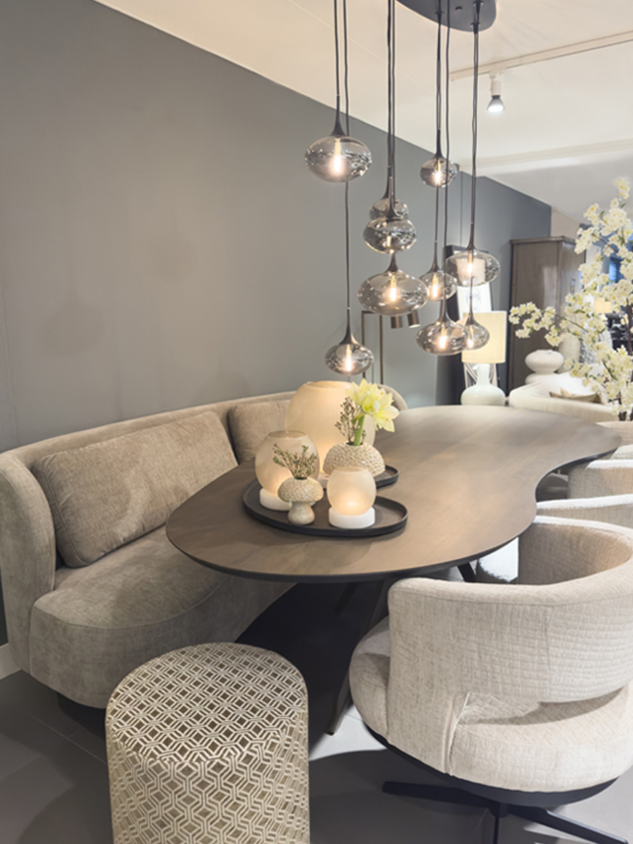Dining nook with modern table, dining bench, and designer chairs