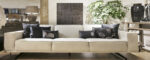 Modern sofa with decorative cushions.
