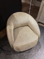 Round beige armchair with texture