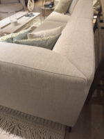 Modern beige sofa with cushions