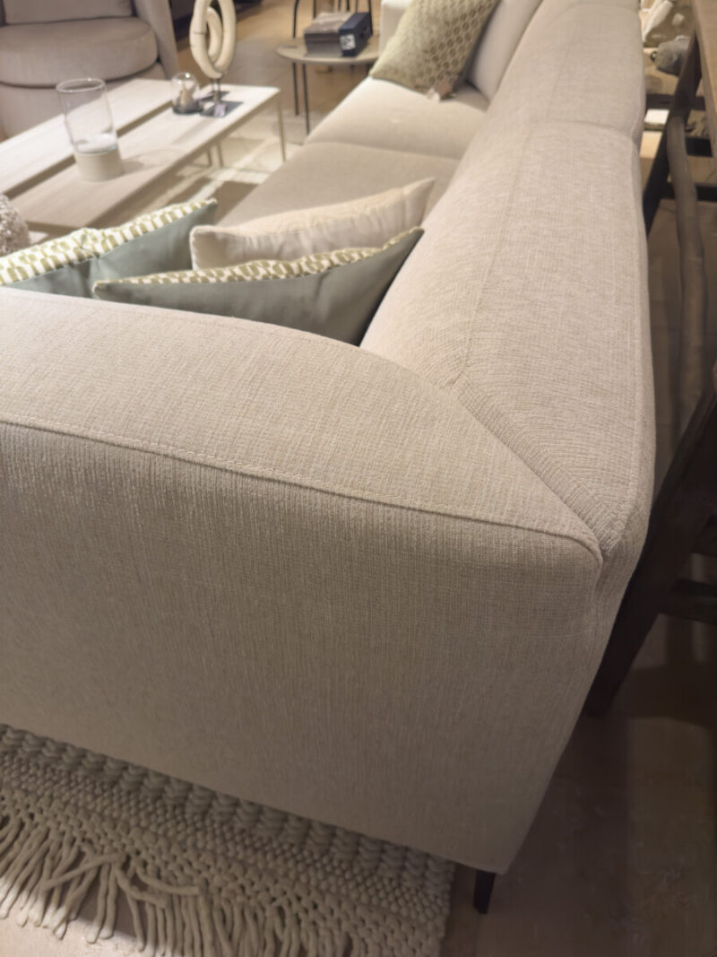 Modern beige sofa with cushions