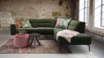 Green sofa in an industrial interior