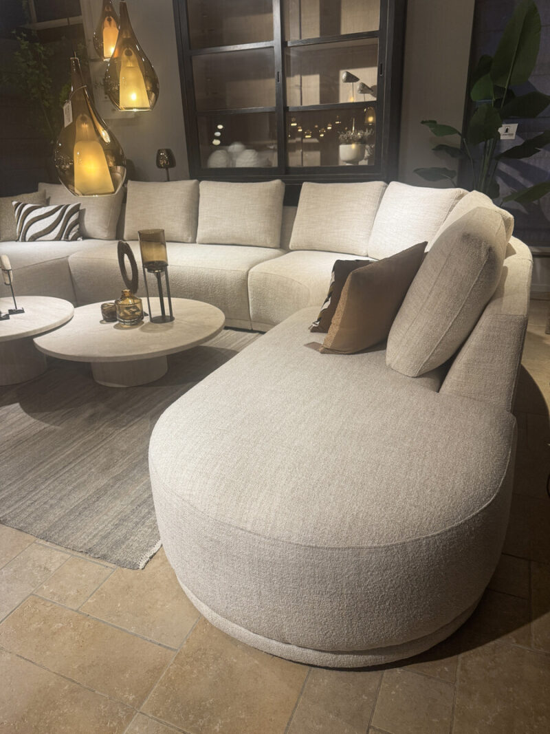 Modern, comfortable sofa with cushions.