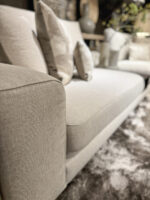 Light sofa with cushions and carpet