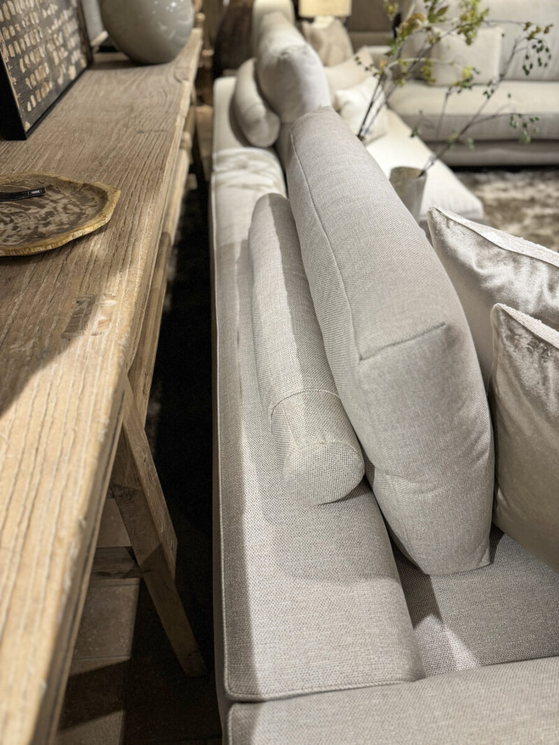 Modern sofa with cushions and table