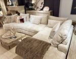 Modern, comfortable corner sofa with cushions.
