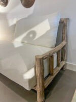 Modern sofa with wooden armrests