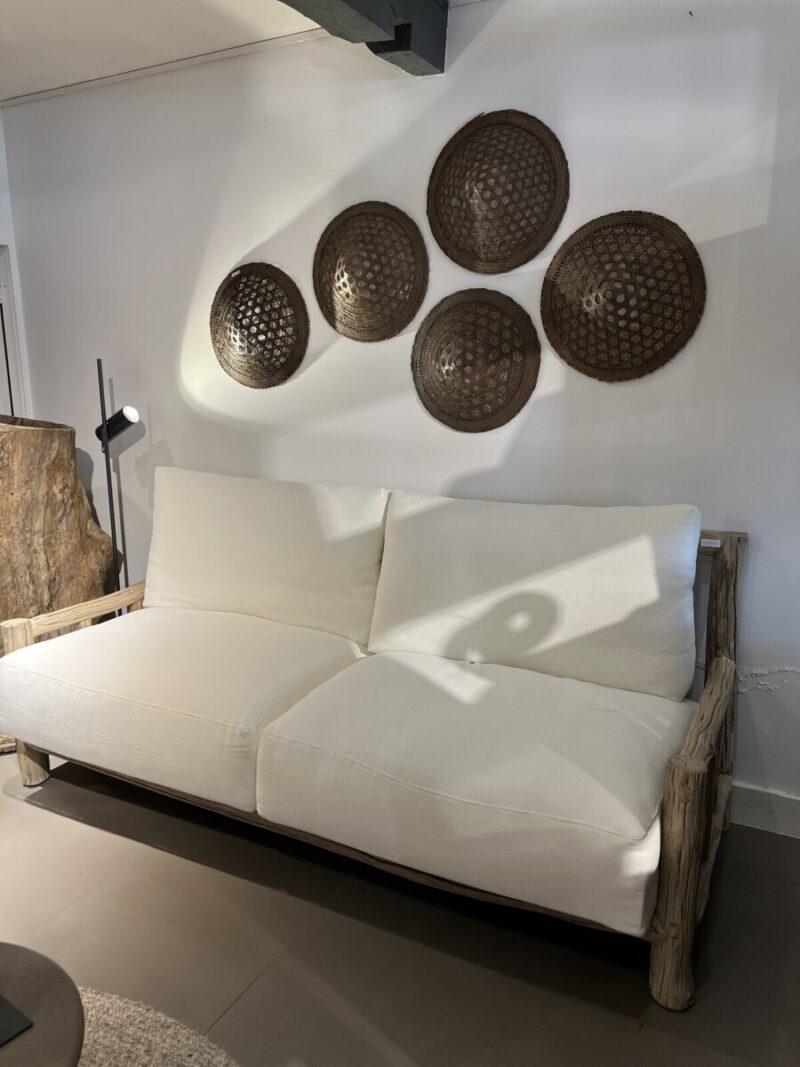 White sofa with decorative bowls
