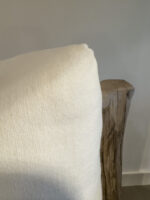 White cushions on a wooden chair