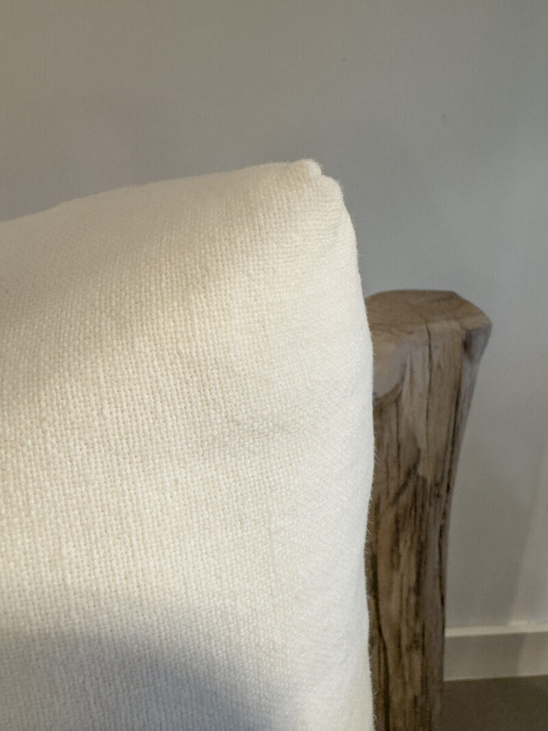 White cushions on a wooden chair