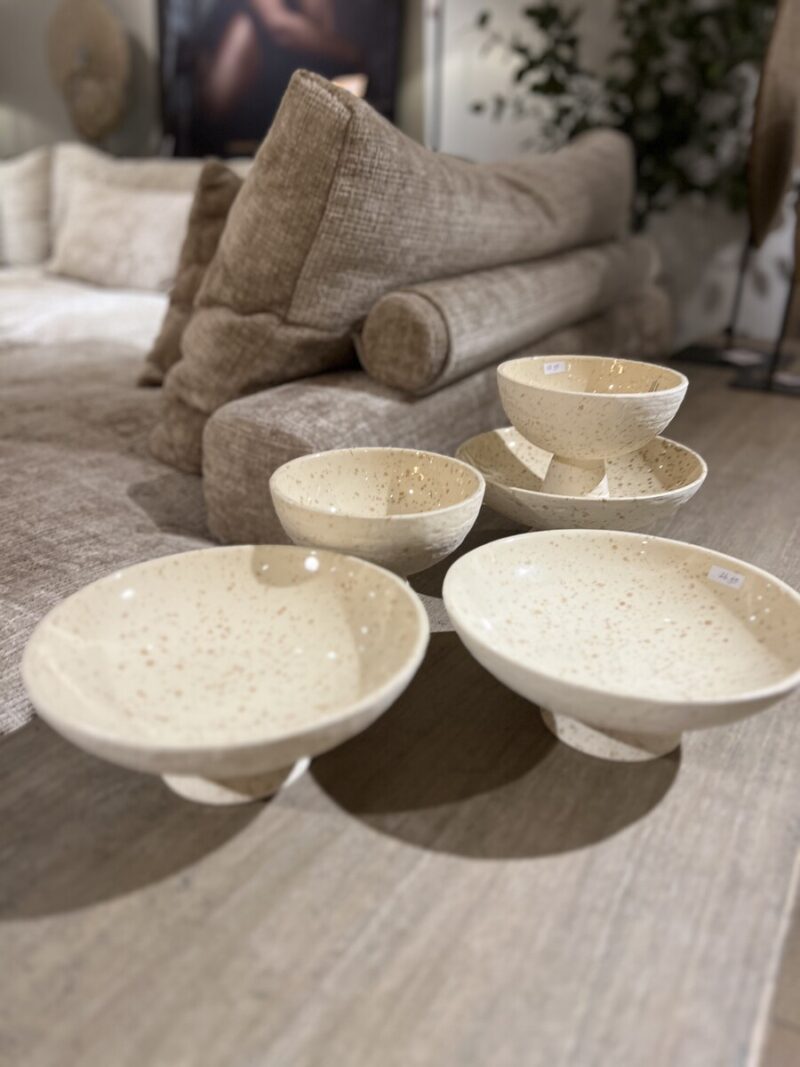 Five ceramic bowls on the table