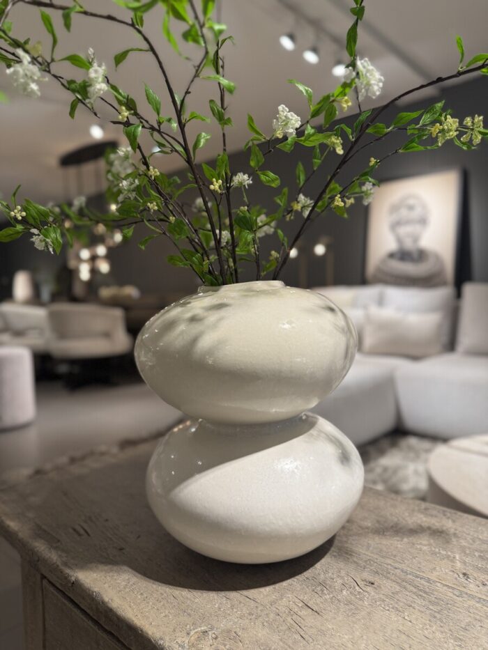 White vase with branches and flowers