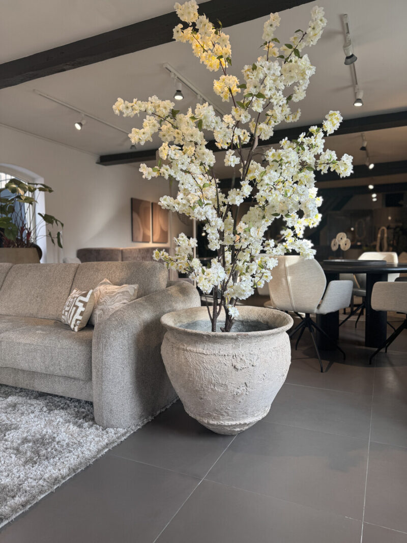 Vase with artificial flowers in living room