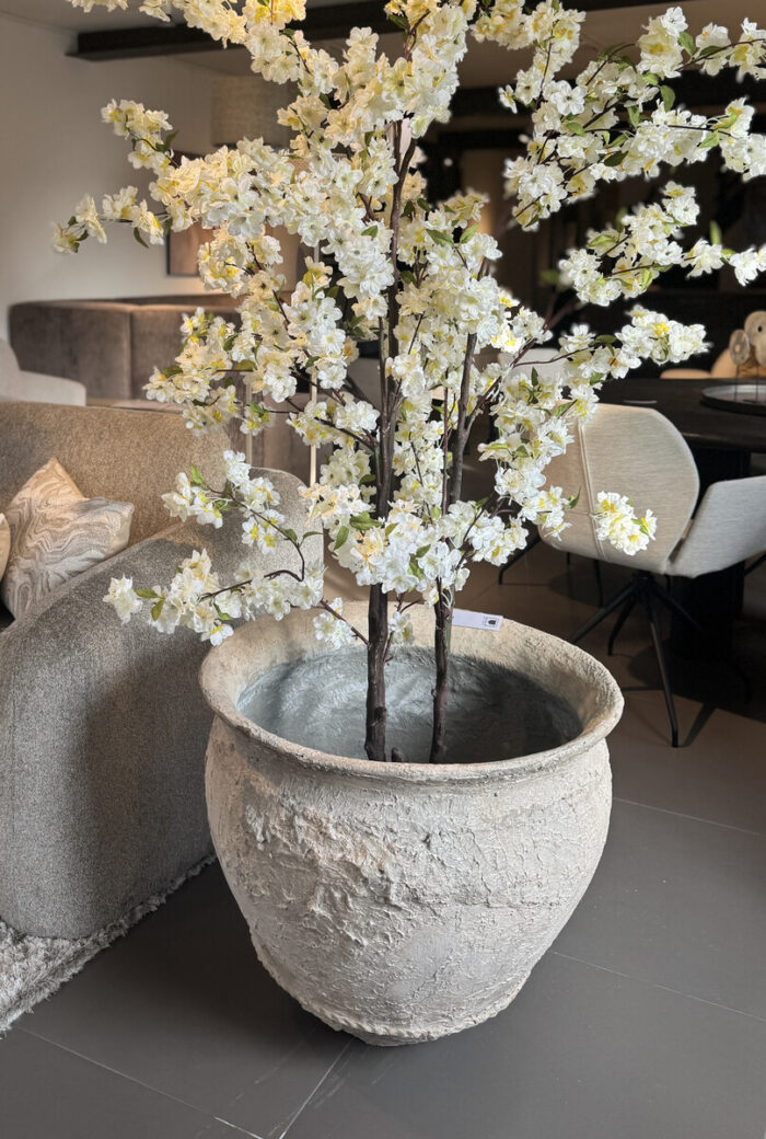 Vase with artificial flowers in living room