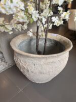 Large pot with flowers and branches