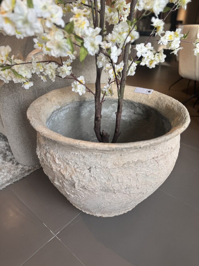 Large pot with flowers and branches